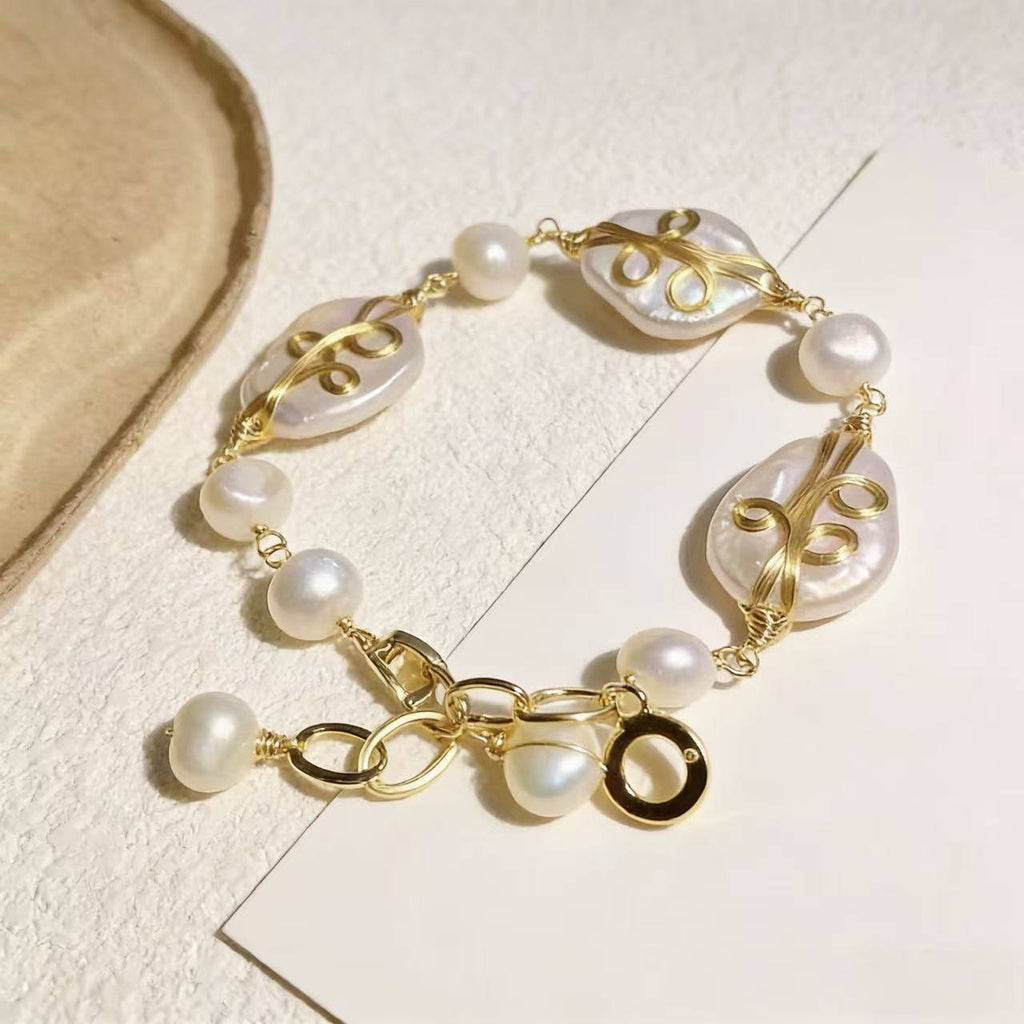 Ocean-inspired pearl shell bracelet with freshwater pearls and delicate gold wire details, elegant handmade jewelry