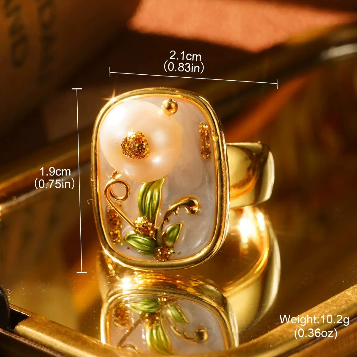 Elegant gold floral ring showcasing a pearl flower with detailed craftsmanship.