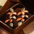 Colorful gradient enamel leaf earrings with gold detailing