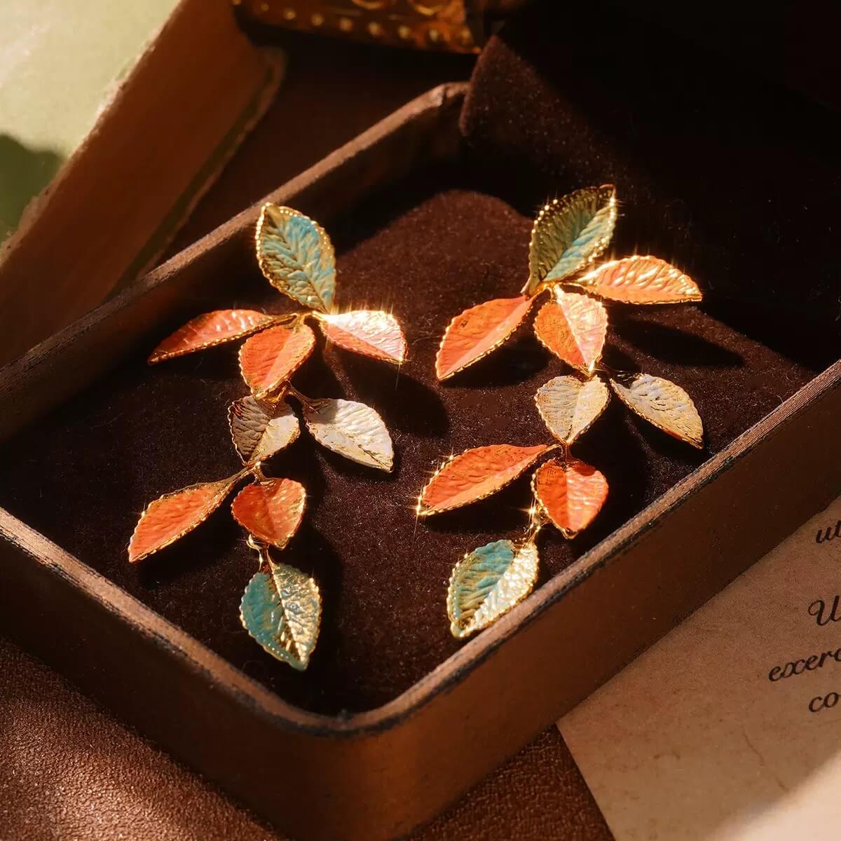 Colorful gradient enamel leaf earrings with gold detailing