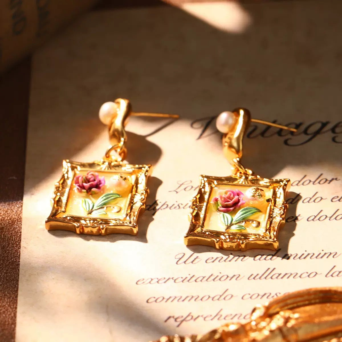 Vintage gold earrings with hand-painted rose artwork in ornate frame design, ideal Christmas jewelry gift.