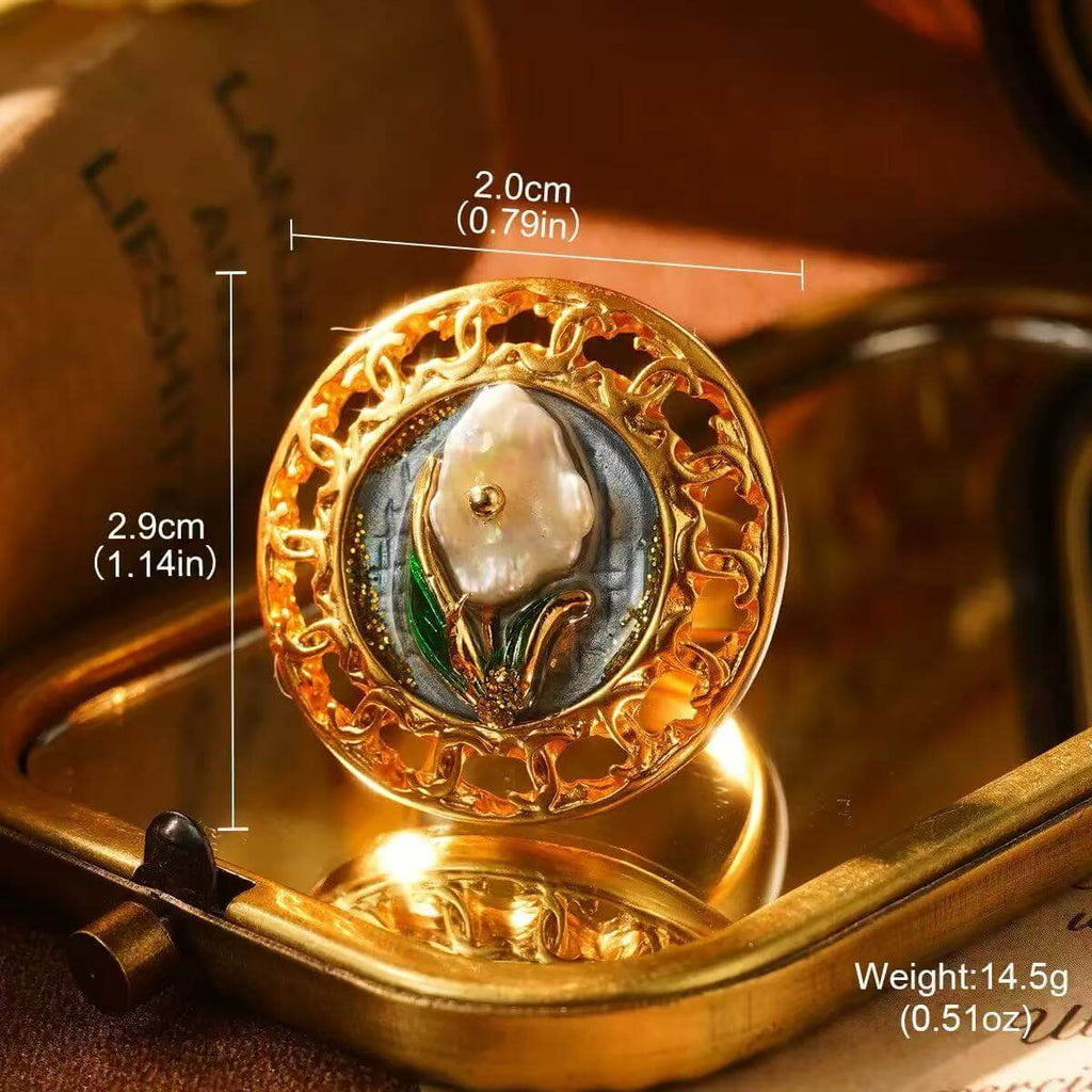 Elegant gold floral ring showcasing a pearl flower with detailed craftsmanship.
