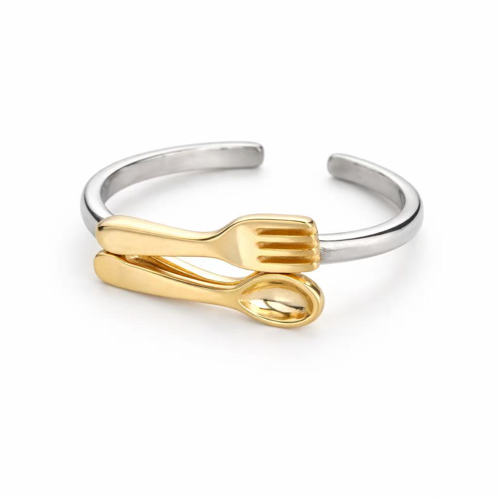 Funny fork and spoon ring designed as niche designer jewelry, playful cutlery inspired ring with artistic and modern character