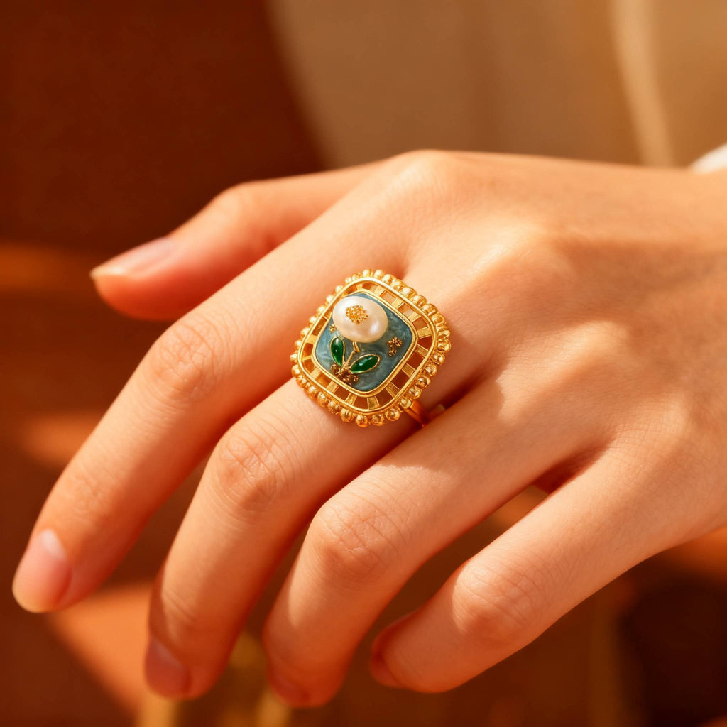 Artistic gold flower ring with pearl centerpiece for holiday shopping.