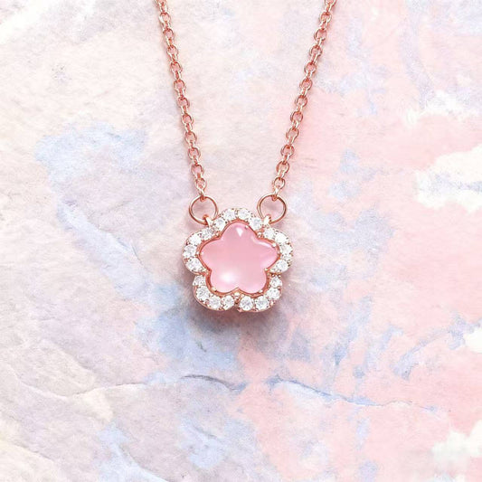 Rose gold necklace with pink flower-shaped gemstone pendant for Christmas gift.