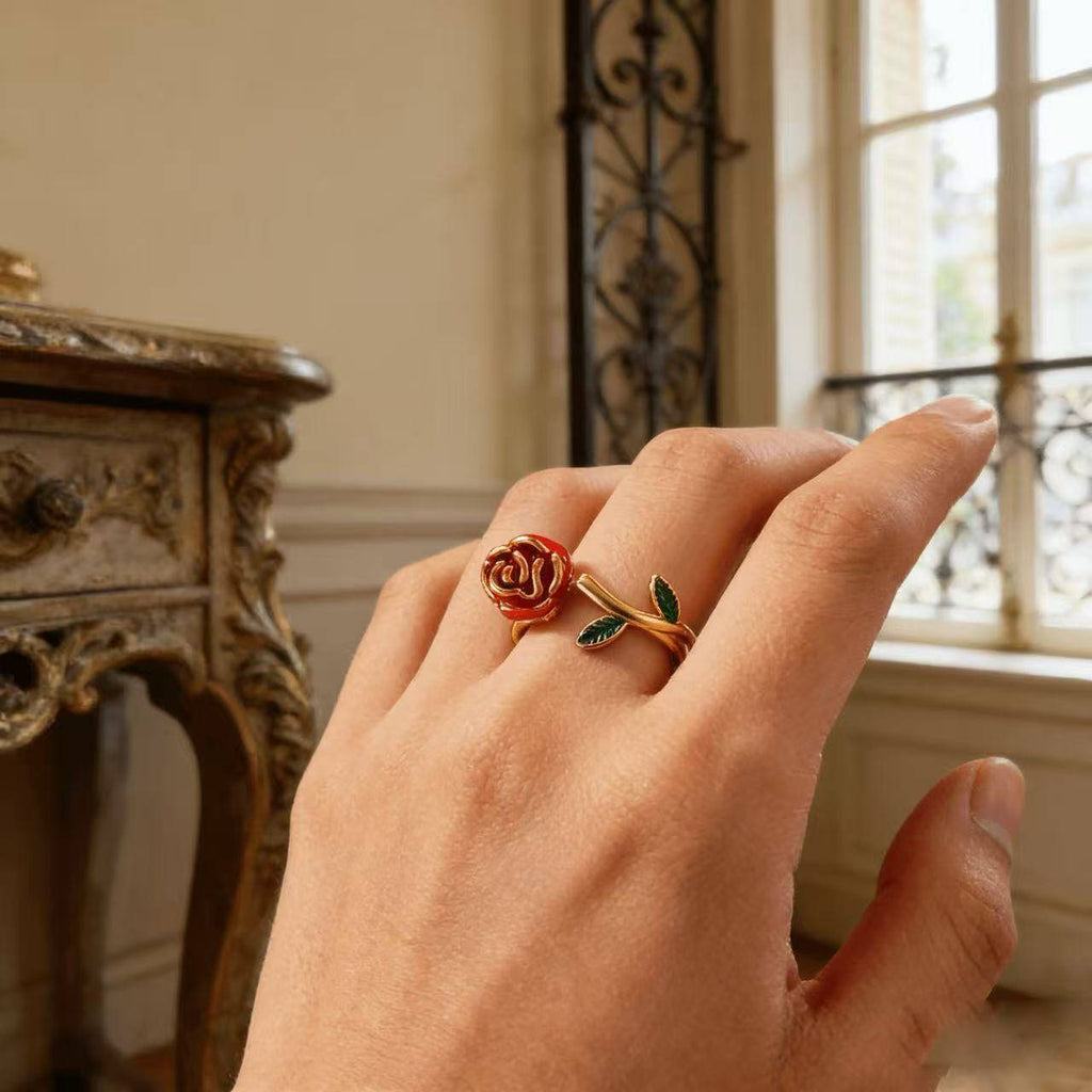 Vintage-inspired rose flower ring with a gold stem design, handcrafted enamel details, and an adjustable open band for a comfortable fit.