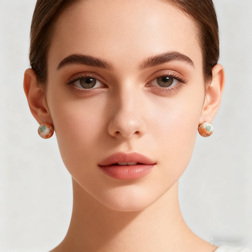 Artistic gold drop earrings featuring miniature framed rose painting with vintage detailing, styled for holiday gifting.