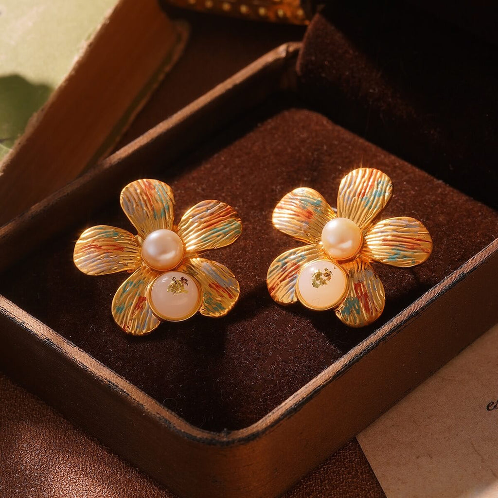 Vintage gold flower earrings with pearl center and enamel petals