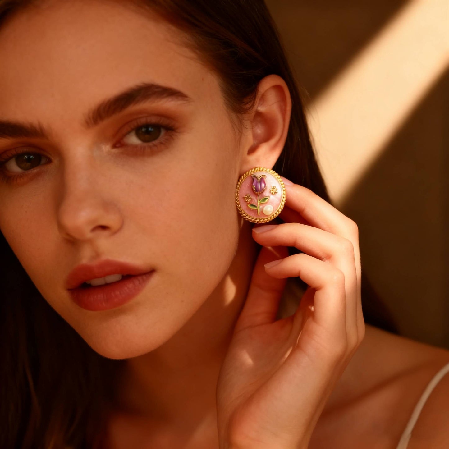 Bella Rosa earrings with a sculpted rose, gold frame, and subtle pearl accent.